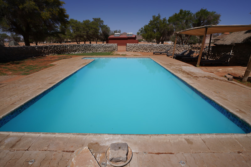 Crystal blue swimming pool at Sesriem Camping Sossusvlei